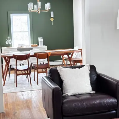 a living room with a couch and a dining room table at Kenoza Lake Waters wLake AccessCanoeIce-fish in Callicoon
