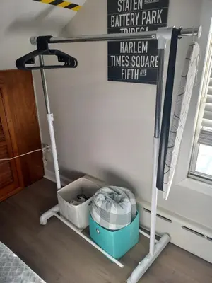 a treadmill in the corner of a room at Cozy attic guest room in North Bergen