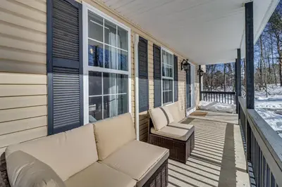a porch with a couch and chairs on a house at Family Retreat with Game Room, 4 Mi to Kalahari! in Emerald Lakes