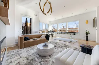a living room with a couch and a table at Modern Lakeview Home with Private Dock Sleeps 5 in Landing
