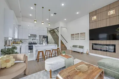 a living room with a couch and a table at 6 Mi to Manhattan Luxe Apt with City Views! in Jersey City