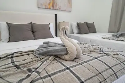 a towel animal sitting on top of a bed at 5 beds 7 person Prime Location Near Transit NYC in Jersey City
