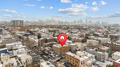 a view of a city with a red street sign at 5 beds 7 person Prime Location Near Transit NYC in Jersey City