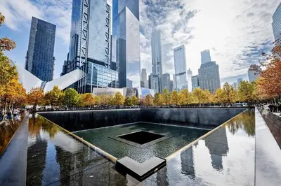 a fountain in a park with a city in the background at Spacious 3BR NYC Manhattan Skyline Views Nearby in West New York