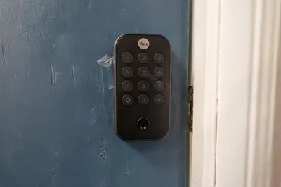 a remote control is attached to a blue door at Bright 4B - Full Kitchen -15 min to Mannhatan in Jersey City
