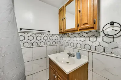 a bathroom with a sink and a mirror at Group Getaway with Fire Pit Near Susquehanna River! in Danville