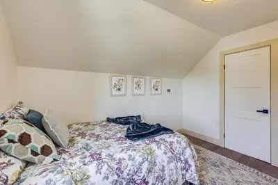 a bedroom with a bed with a blanket on it at Walk to Public Transit Family Home in Mount Airy! in Philadelphia