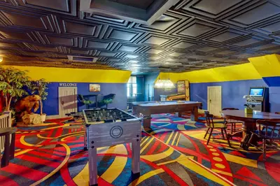 a room with a ping pong table and a ping pong tablektop at Fun and Unique Home with Vintage Game Room in Annville in Annville