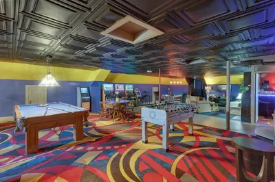 a room with a pool table and ping pong tables at Fun and Unique Home with Vintage Game Room in Annville in Annville