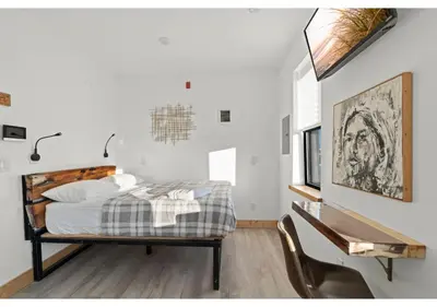 a bedroom with a bed and a desk and a table at Philadelphia Rocky steps GSN Harvest 2 in Philadelphia