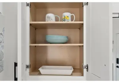a cupboard with a bowl and dishes in it at The Franklin institute GSN Harvest 3 in Philadelphia