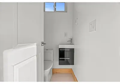 a white kitchen with a sink and a stove at Center city Philadelphia GSN Harvest 4 in Philadelphia