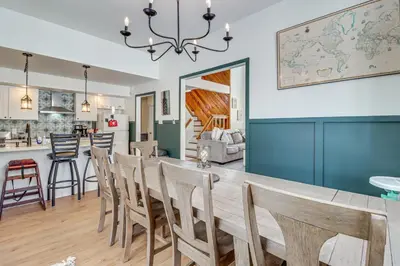 a dining room and kitchen with a table and chairs at 1 Mi to Big Boulder Mountain Townhome with Grill in Lake Harmony