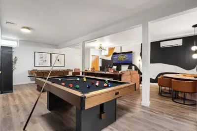 a living room with a pool table in it at Luxury Escape 5BR Pool HotTub Game Room FirePit in Long Pond