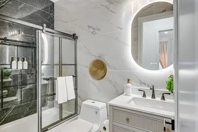 a bathroom with a toilet and a shower and a sink at Luxe Group Getaway 6 Mi to Manhattan! in Jersey City