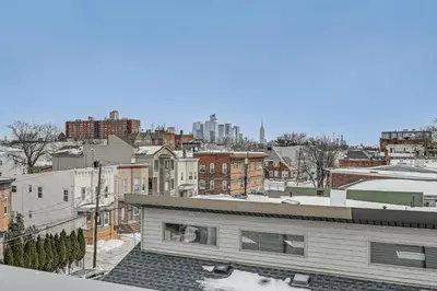 a view of a city from the roof of a building at Luxe Group Getaway 6 Mi to Manhattan! in Jersey City