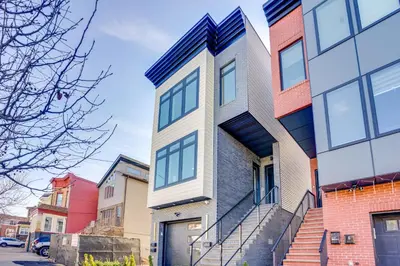 a house with a geometric design on a street at Luxe Group Getaway 6 Mi to Manhattan! in Jersey City