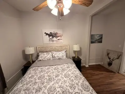 a bedroom with a bed and a ceiling fan at Casa Yael in West New York