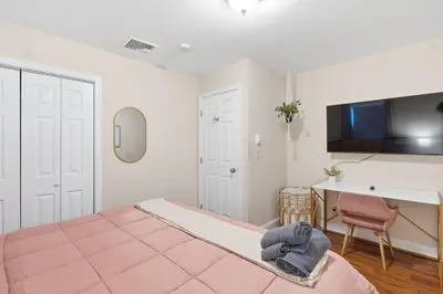 a bedroom with a bed and a desk and a television at 5 min Shawnee Mountain, Hot tub, Game Rm, 3 Kings in East Stroudsburg