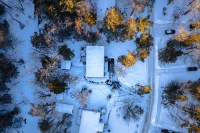 an overhead view of a snow covered road with trees at Bear Trails Retreat-Pocono Getaway Near Kalahari in Pocono Summit