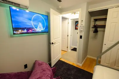 a living room with a flat screen tv on a wall at Bear Trails Retreat-Pocono Getaway Near Kalahari in Pocono Summit