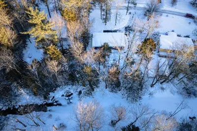 an aerial view of a snow covered yard with trees at Bear Trails Retreat-Pocono Getaway Near Kalahari in Pocono Summit