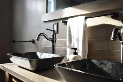 a bathroom with a black sink and a mirror at A-Frame Chalet Ski Lodge Near Shawnee in East Stroudsburg