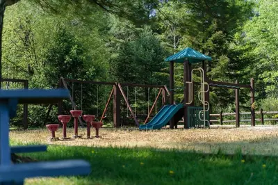 a park with a playground with a slide at The Aerie House in Blakeslee