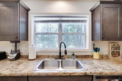 a kitchen with a sink and a window at The Aerie House in Blakeslee