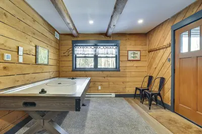 a room with a table and chairs and a window at Poconos Ski Base with Hot Tub and Game Room! in Lake Harmony