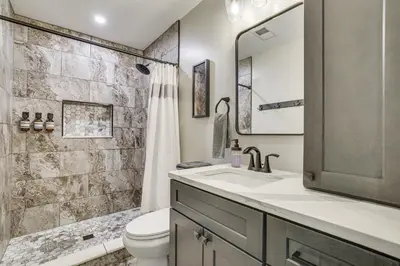 a bathroom with a sink and a toilet and a shower at Poconos Ski Base with Hot Tub and Game Room! in Lake Harmony