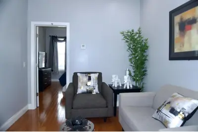 a living room with a couch and a chair at New York Private room 30 in West New York