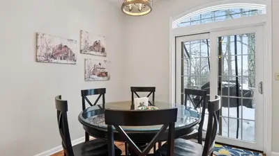a dining room with a glass table and chairs at Crestline Retreat by AvantStay Luxury Mountain Condo with Hot Tub BBQ Game Room Steps to Big Boulder in Lake Harmony
