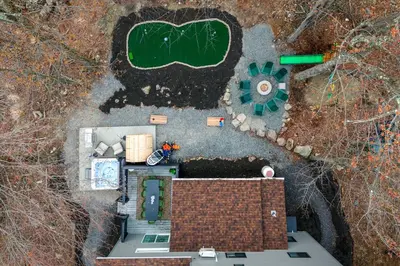an overhead view of a house with a garden at Luxury Pocono Escape ~ Sauna | Hot Tub | Mini Golf in Tobyhanna