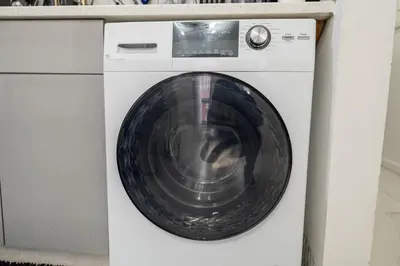 a white washing machine with a silver bowl on it at Modern 3 Bedroom 7 minutes to Manhattan in Jersey City