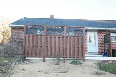 a wooden fence in front of a house at Cozy 1 bedroom house in Lititz in Lititz