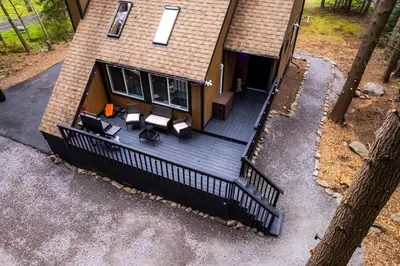 an aerial view of a house with a deck at Deer Trails Retreat -Pocono Getaway Near Kalahari in Pocono Summit