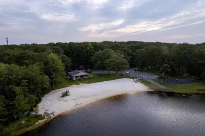 an aerial view of a house on the shore of a lake at Deer Trails Retreat -Pocono Getaway Near Kalahari in Pocono Summit