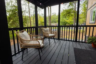 two chairs sitting on a screened in porch at Deer Trails Retreat -Pocono Getaway Near Kalahari in Pocono Summit