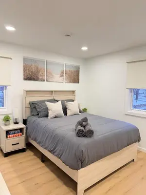 a bedroom with a large bed in a room at 35 to NYC - Netflix - 2Beds -1BR - FIFA 2026 in Passaic