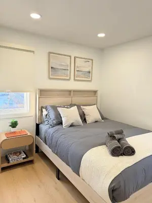 a bedroom with two beds and a window at 35 to NYC - Netflix - 2Beds -1BR - FIFA 2026 in Passaic