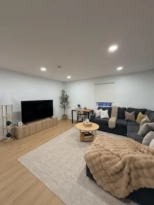 a living room with a couch and a table at 35 to NYC - Netflix - 2Beds -1BR - FIFA 2026 in Passaic