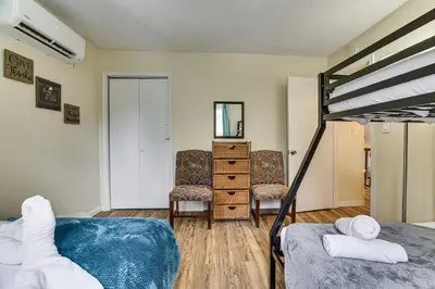 a bedroom with two beds and a bunk bed at Steps to Lake! Family Haven with Hot Tub in Poconos in Tobyhanna