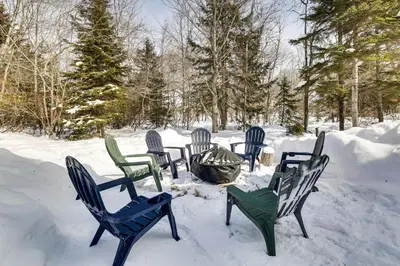 a group of chairs sitting in the snow at Steps to Lake! Family Haven with Hot Tub in Poconos in Tobyhanna