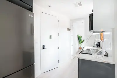 a kitchen with a sink and a counter top at 48-4FE 2BR Prime Midtown West in New York