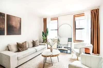 a living room with a couch and a table at 319-3A XL New Modern 1BR Union Square WD in Unit in New York