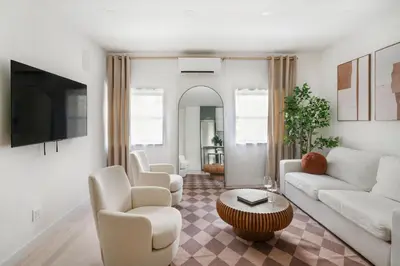 a living room with a couch and chairs and a table at 317-4B Brand New Modern 1BR Union Square WD in Unit in New York