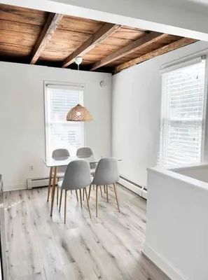 a dining room with a table and four chairs at Chic Phoenixville Retreat With Parking in Phoenixville