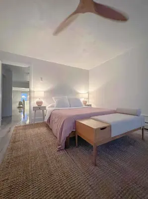 a bedroom with a large bed and a ceiling fan at Chic Phoenixville Retreat With Parking in Phoenixville