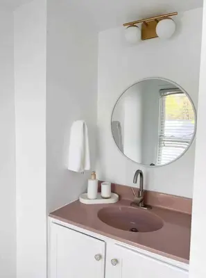 a bathroom with a sink and a mirror at Chic Phoenixville Retreat With Parking in Phoenixville